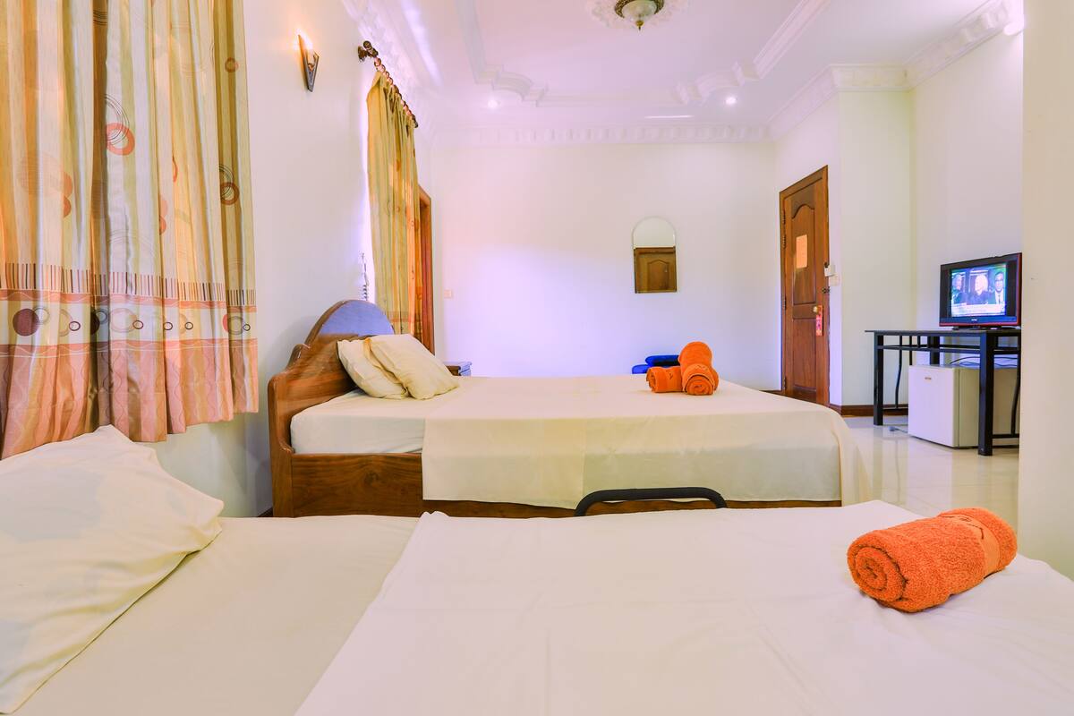 Family Room (Free Pick up) | 1 bedroom, minibar, desk, iron/ironing board (on request)