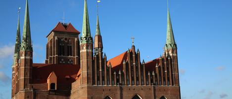 A large, historic church with multiple spires and a prominent central tower.