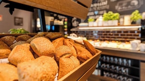 A bakery display with various types of bread and pastries. - Motel One Köln-Mediapark (Cologne)