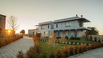 Stunning two-story residence with a central entrance and beautifully maintained garden.