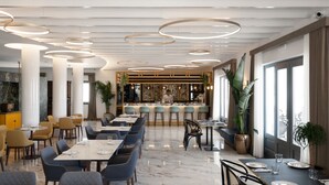 A modern restaurant with a bar area, marble flooring, and a variety of seating options including tables and chairs. - De Sol Spa Hotel (Santorini)