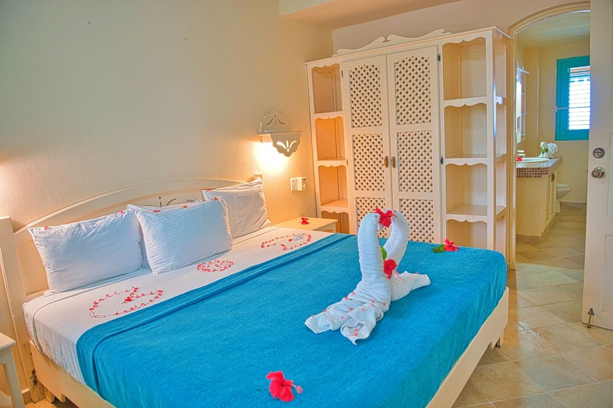 Family Triple Room, Kitchenette, Oceanfront | Egyptian cotton sheets, premium bedding, in-room safe