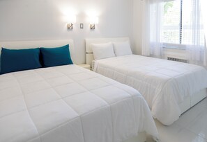 Deluxe Room, 2 Double Beds, Pool View | Desk, free WiFi, bed sheets - Palm Breeze Hotel (Lake Worth)