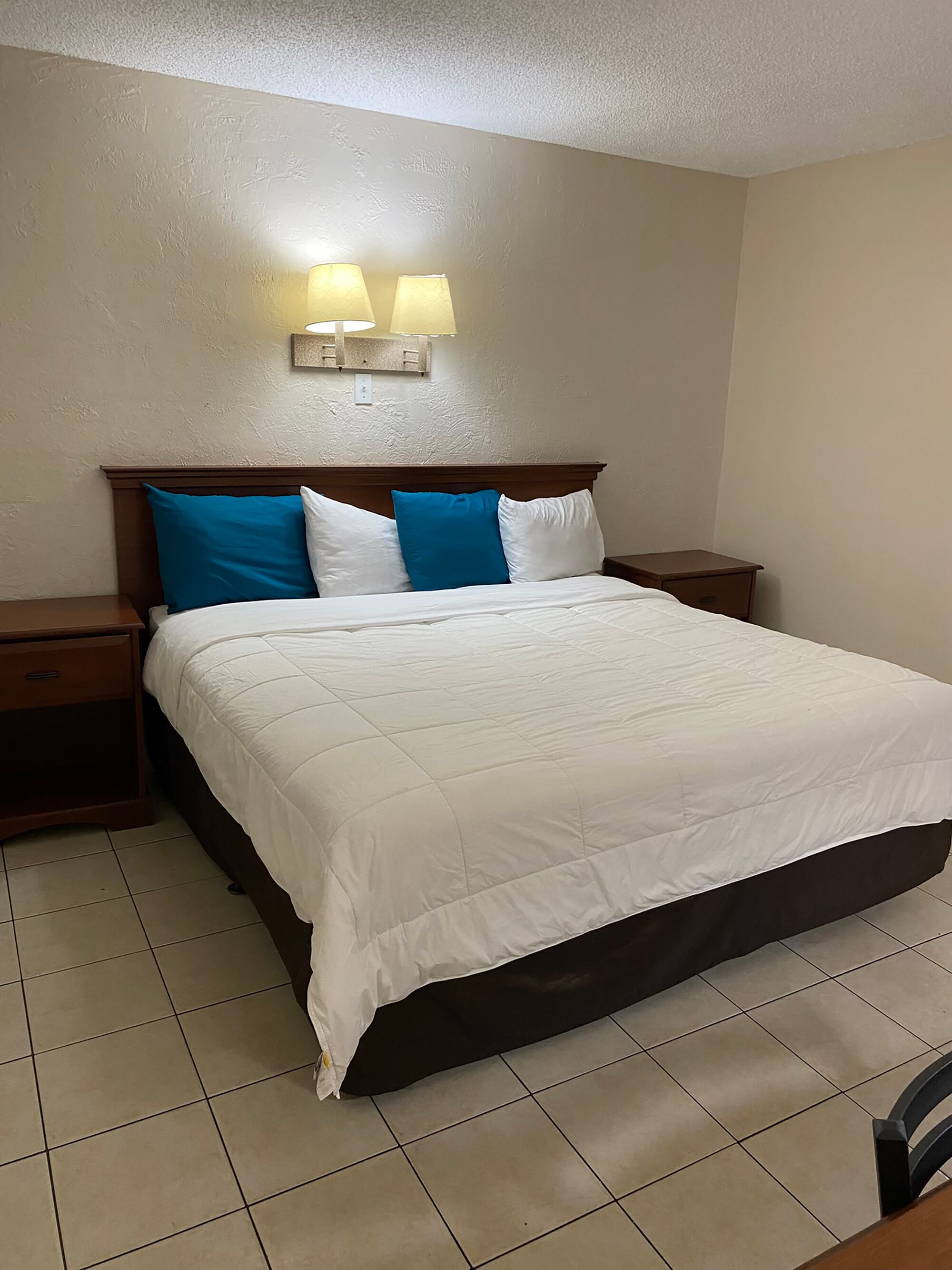 1 King Bed (Sleeps 2) | Desk, free WiFi, bed sheets