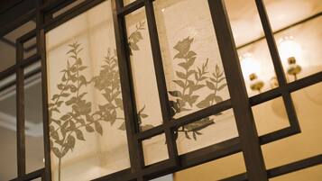 A window with a geometric pattern and a floral design.