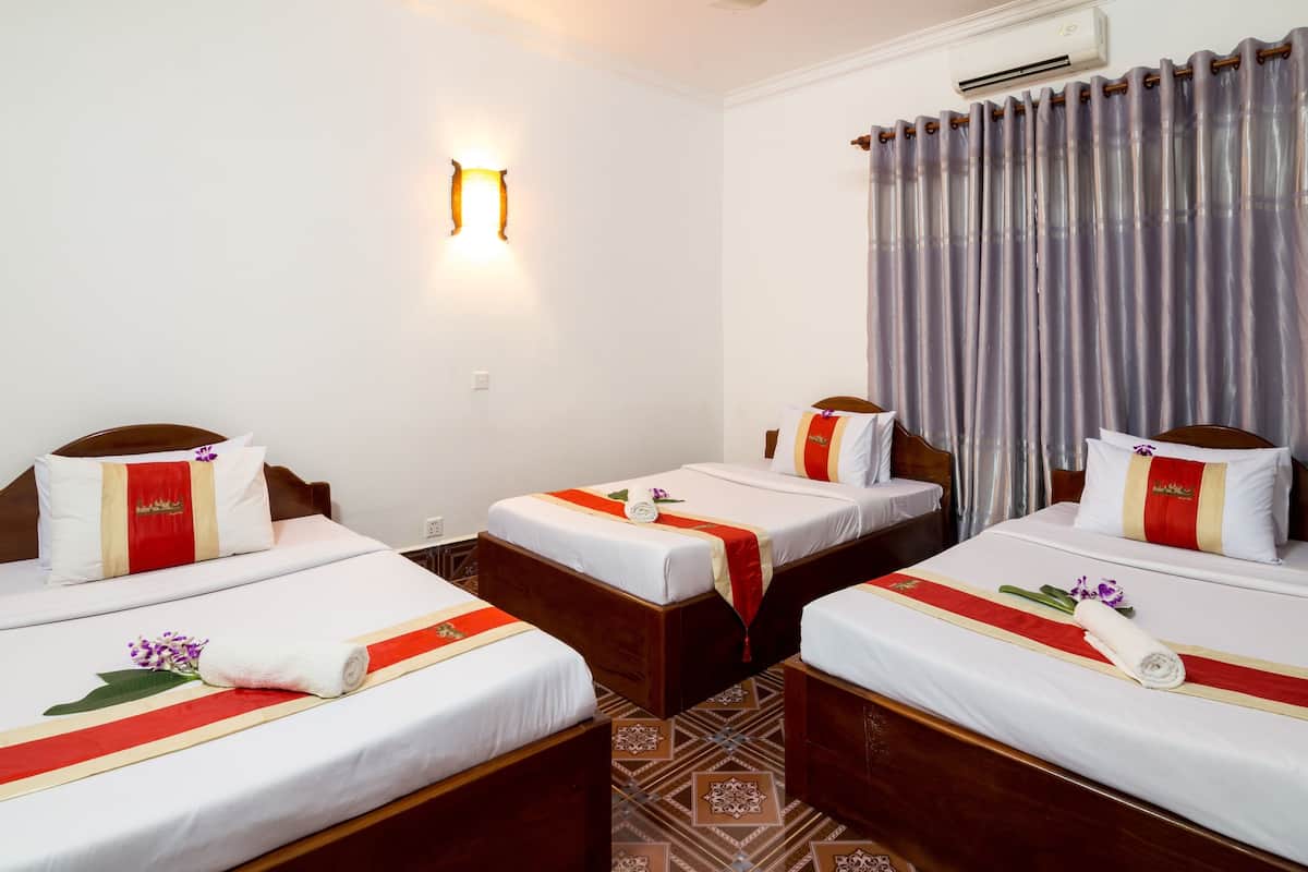 Triple Room | 1 bedroom, minibar, in-room safe, individually decorated