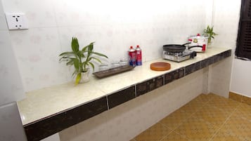 Deluxe Family Room | Private kitchenette | Fridge, microwave, coffee/tea maker, electric kettle