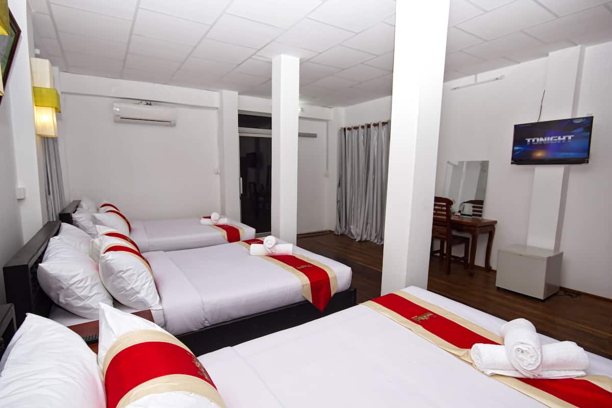 Deluxe Family Room | 1 bedroom, minibar, in-room safe, individually decorated