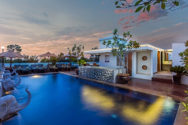 Outdoor pool, a rooftop pool, pool umbrellas, sun loungers