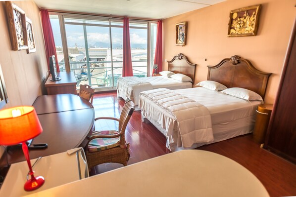 Premium Quadruple Room | Individually decorated, desk, blackout drapes, iron/ironing board