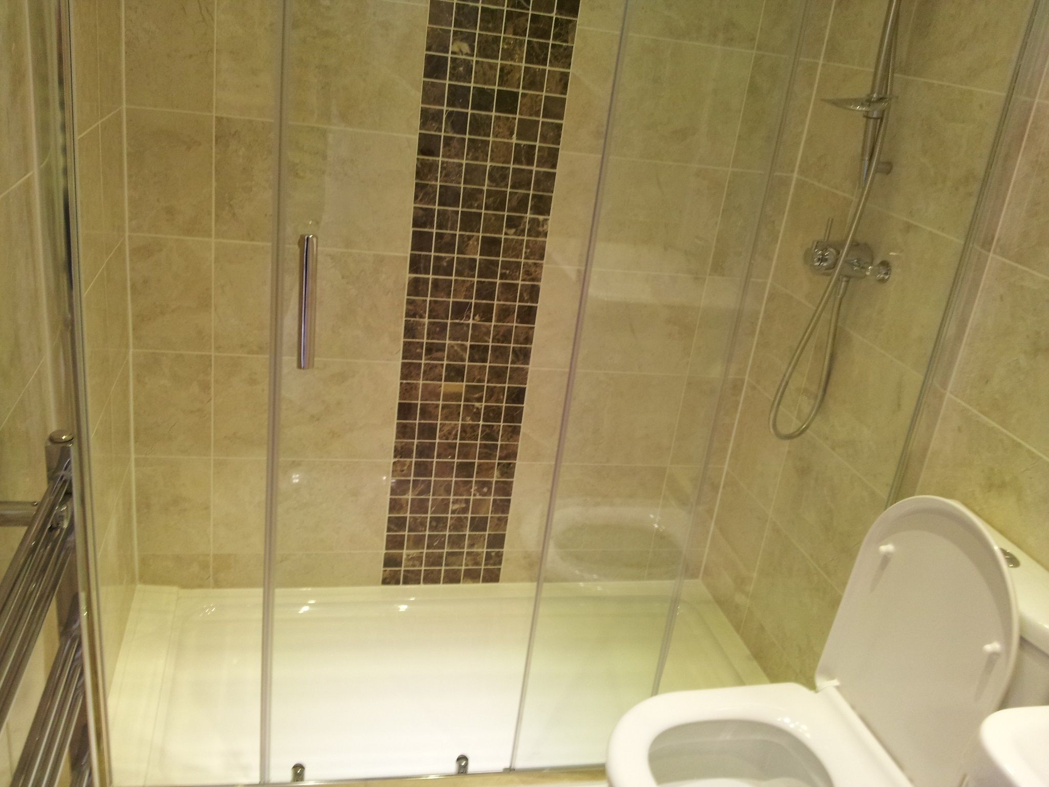 Separate bathtub and shower, hair dryer, towels