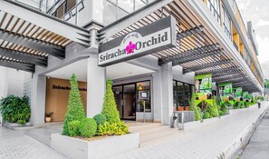 A modern building with a sign reading "Sriracha Orchid". - Sriracha Orchid (Si Racha)