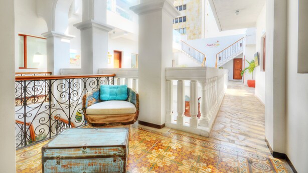A spacious hallway with ornate railings, a patterned floor, and a staircase leading to an upper level. - Masaya Santa Marta (Santa Marta)