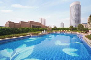 Outdoor pool, open 7:00 AM to 10:30 PM, pool loungers