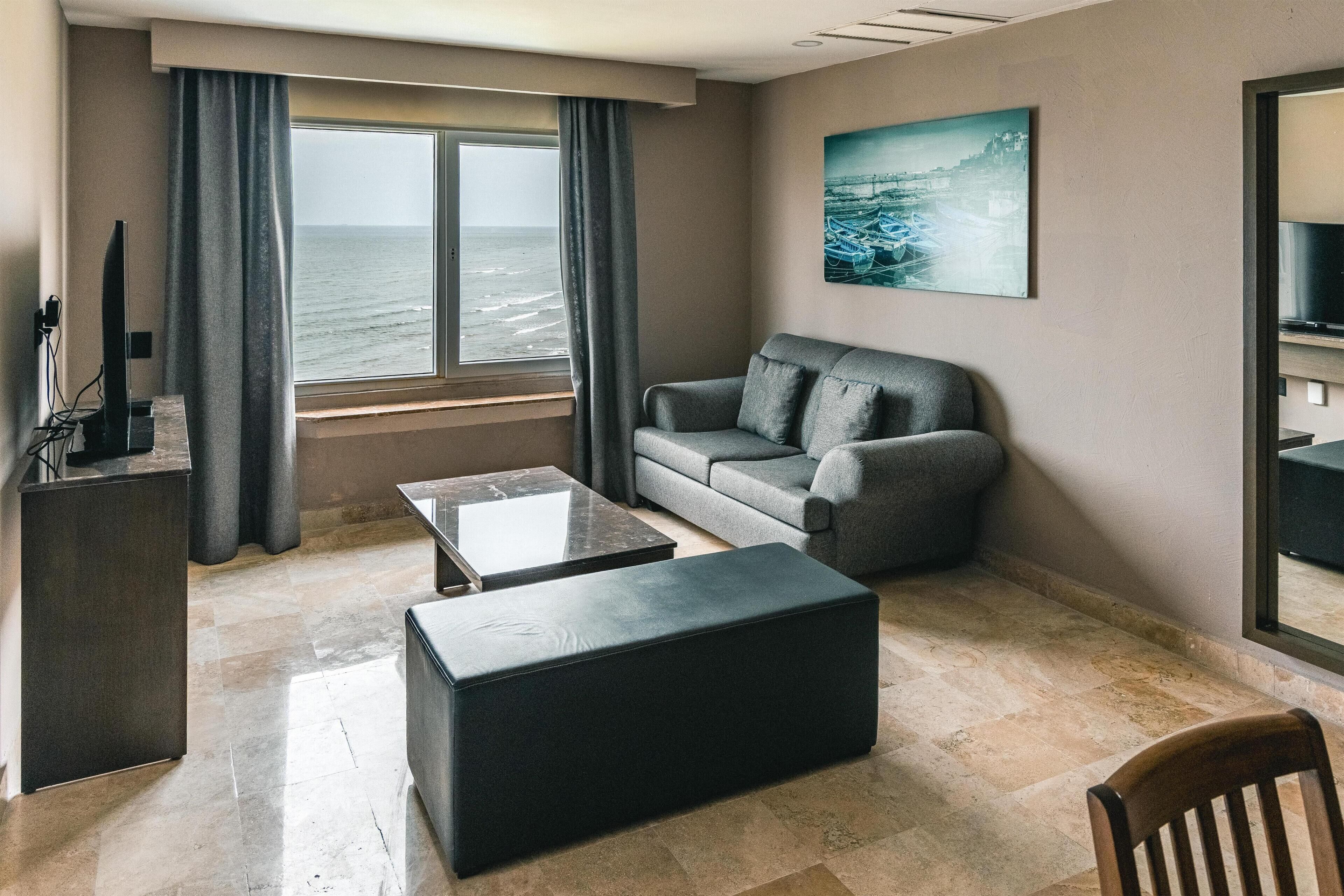 Junior Suite, 1 King Bed, Balcony, Ocean View | Living area | LCD TV, MP3 dock