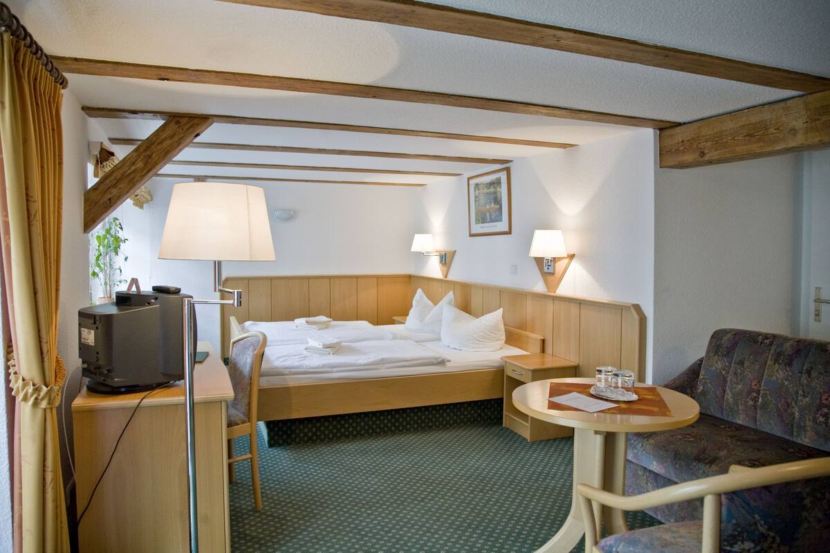 family room | 1 bedroom, premium bedding, in-room safe, desk