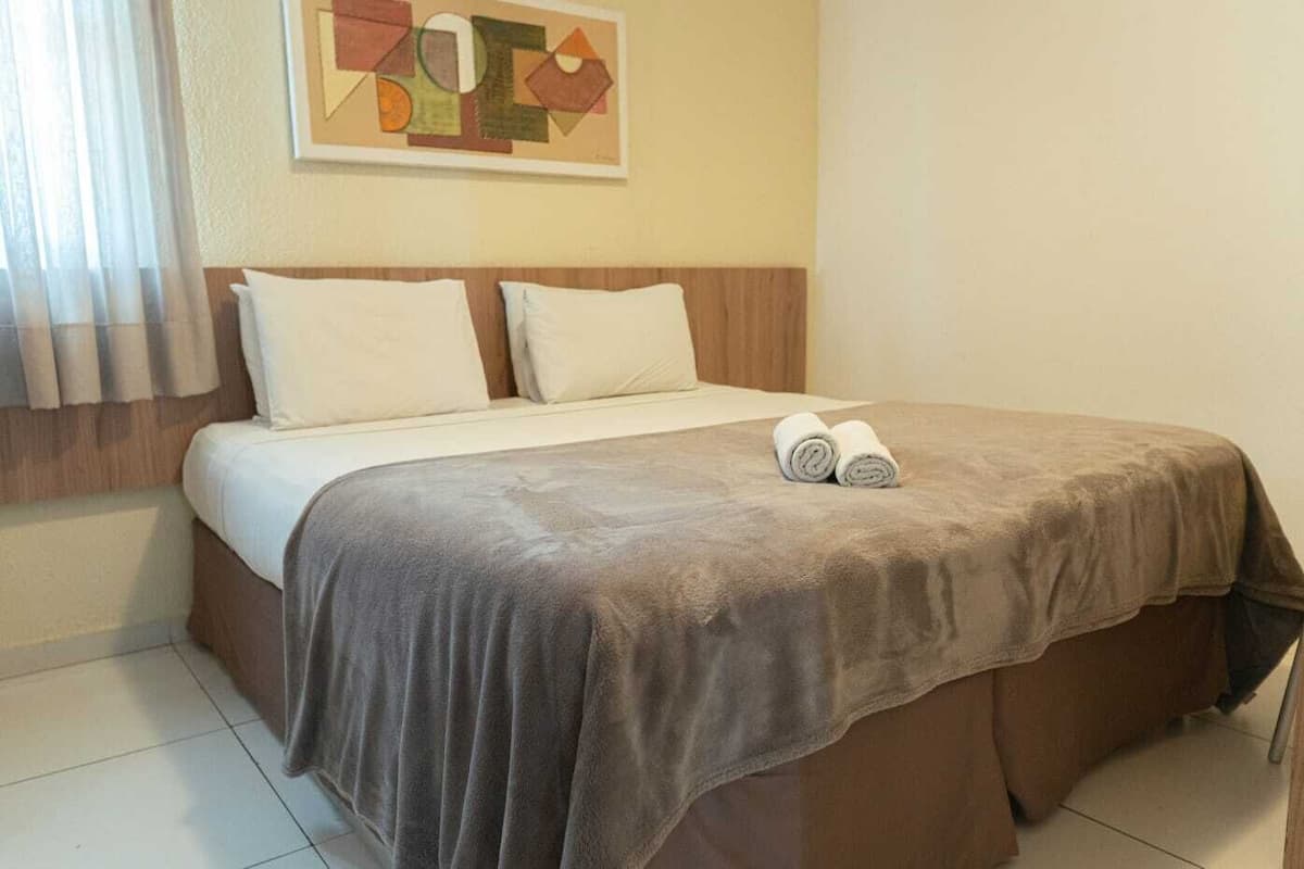 Minibar, desk, blackout curtains, iron/ironing board