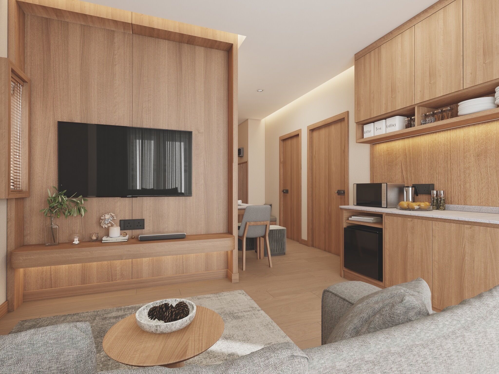 A modern kitchen with wooden cabinets, a built-in microwave, and a coffee station.