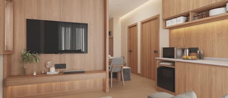 Una cocina moderna con armarios de madera, microondas integrado y espacio para café.