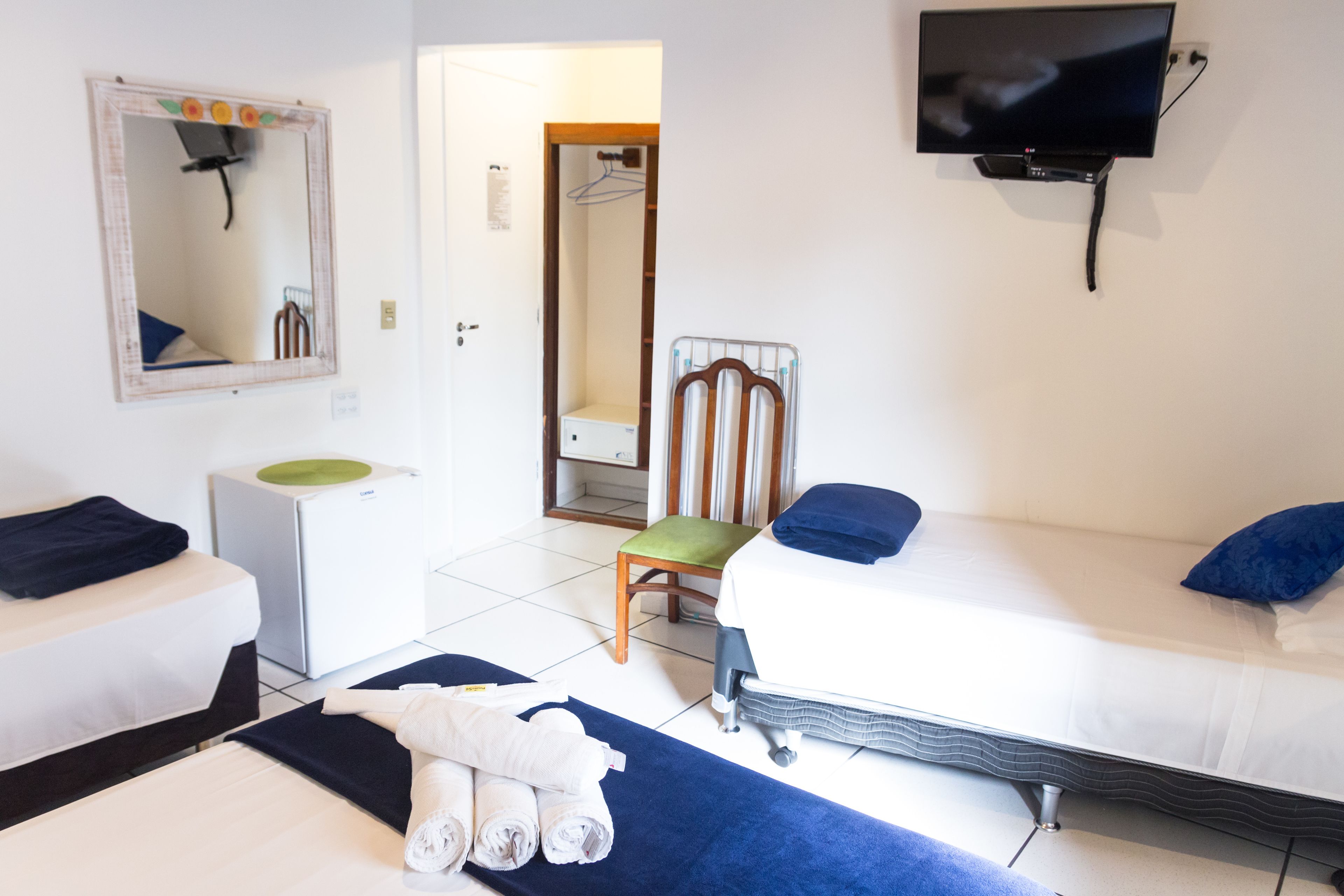 economy quadruple room | minibar, in-room safe, individually decorated, blackout curtains