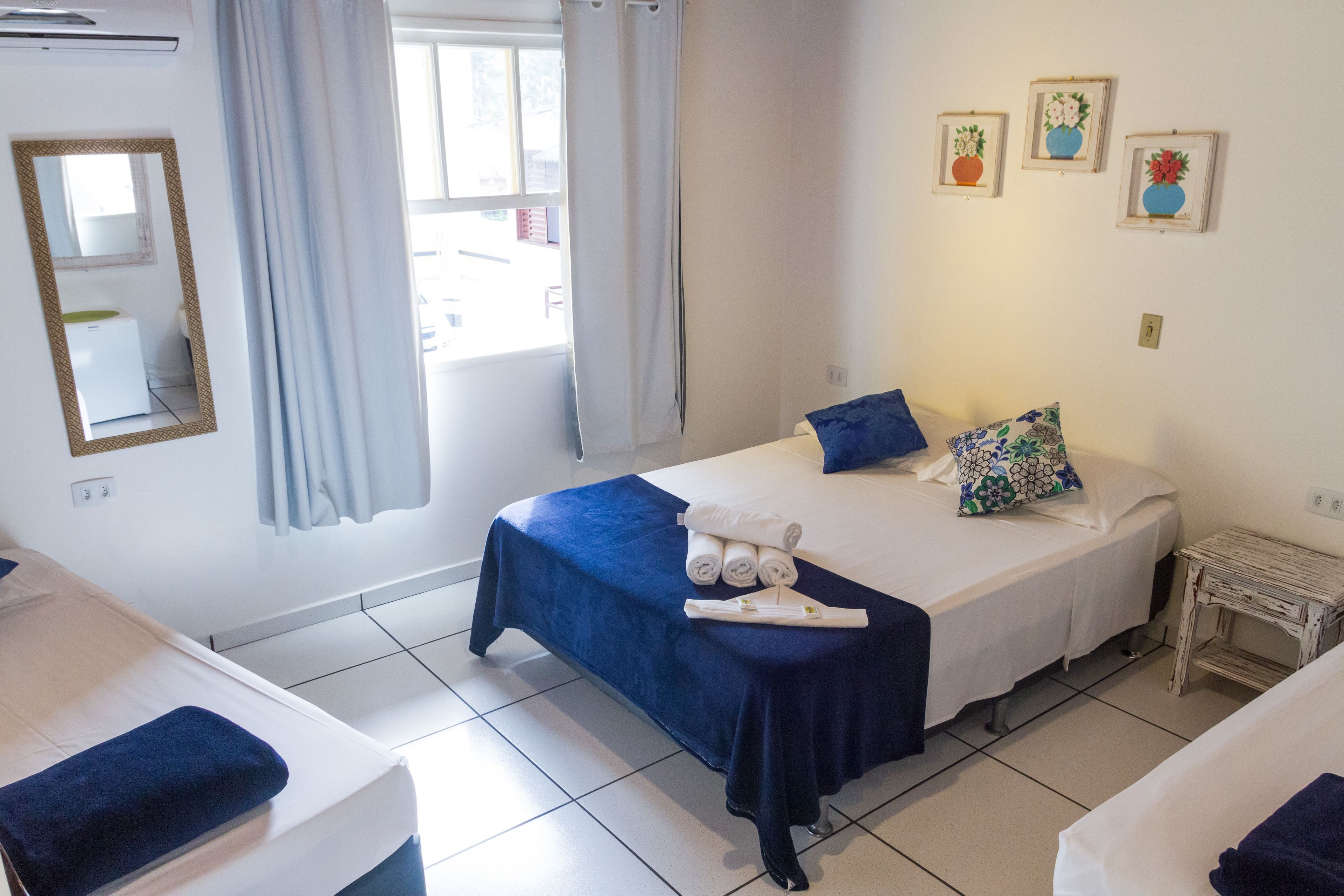 economy quadruple room | minibar, in-room safe, individually decorated, blackout curtains