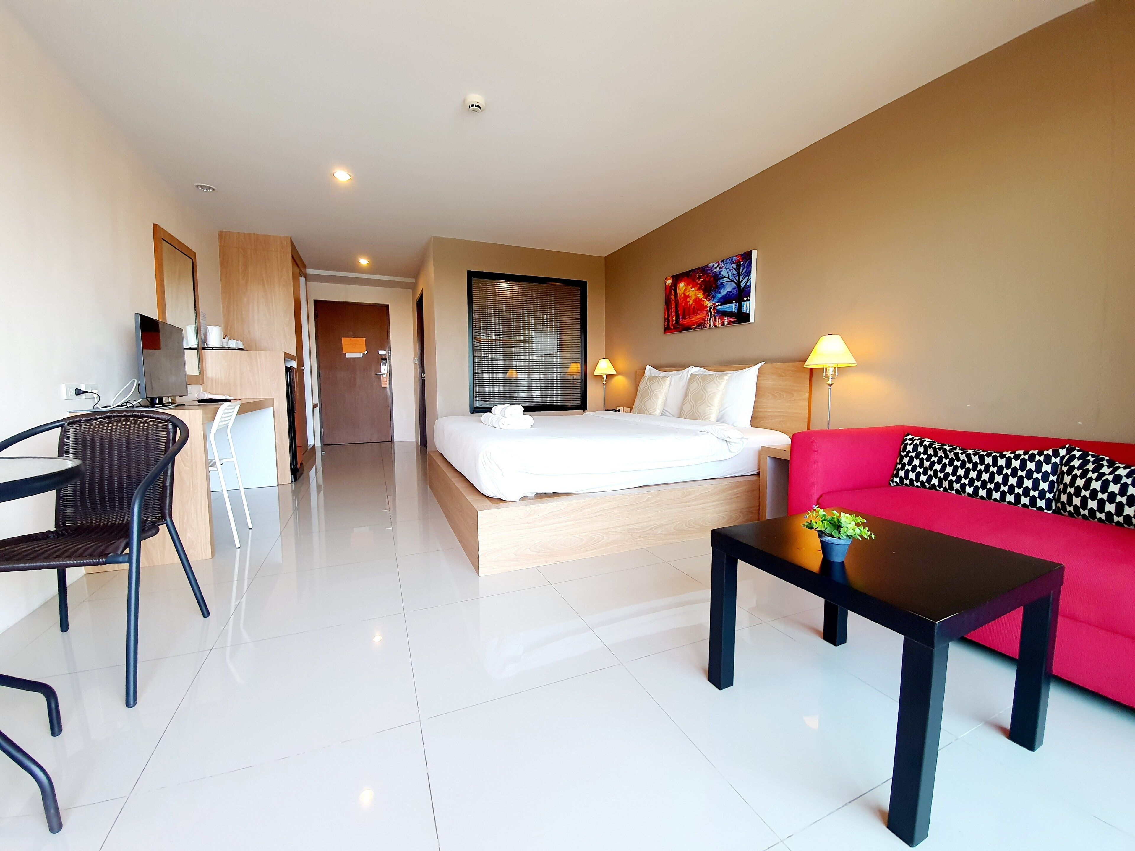 Habitación Deluxe | Ropa de cama de alta calidad y minibar (con algunos artículos gratuitos)