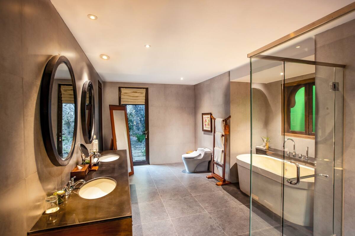 grand spa pool villa | bathroom | rainfall showerhead, eco-friendly toiletries, hair dryer, bathrobes