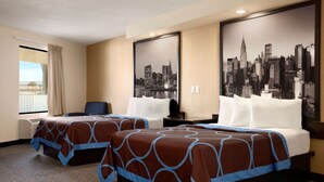 A hotel room with two beds, a desk, and a large cityscape poster on the wall. - Super 8 by Wyndham Rahway/Newark (Rahway)