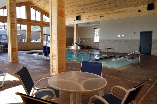 Indoor pool, open 6 AM to 11 PM, pool loungers
