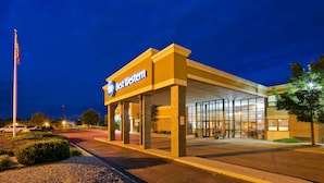 A Best Western hotel with a modern facade, large glass windows, and a well-lit entrance.