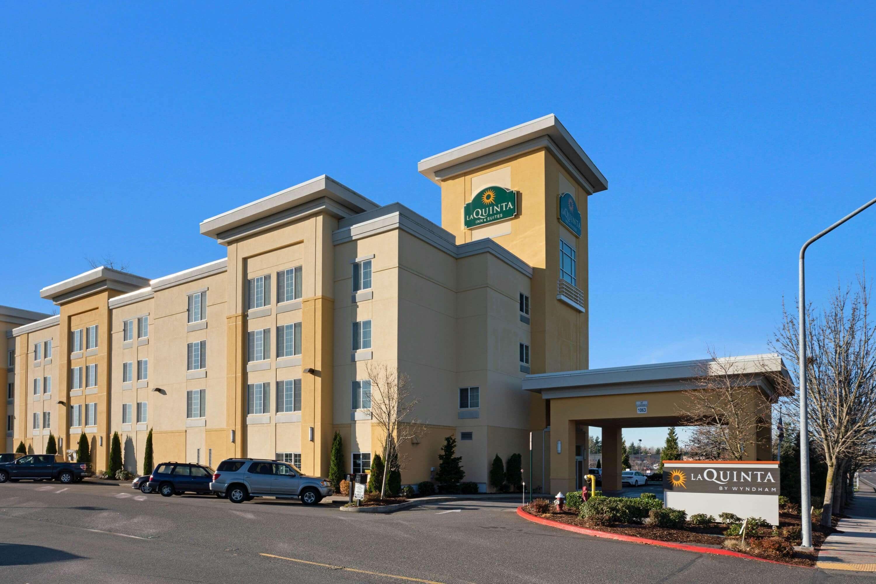 A multi-story hotel with a prominent sign reading "La Quinta by Wyndham."