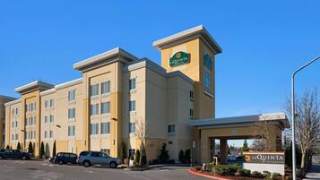 A multi-story hotel with a prominent sign reading "La Quinta by Wyndham."