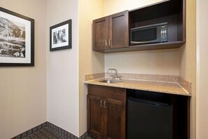 A compact kitchen with a microwave, sink, and dishwasher. - La Quinta Inn & Suites by Wyndham Bellingham (Bellingham)