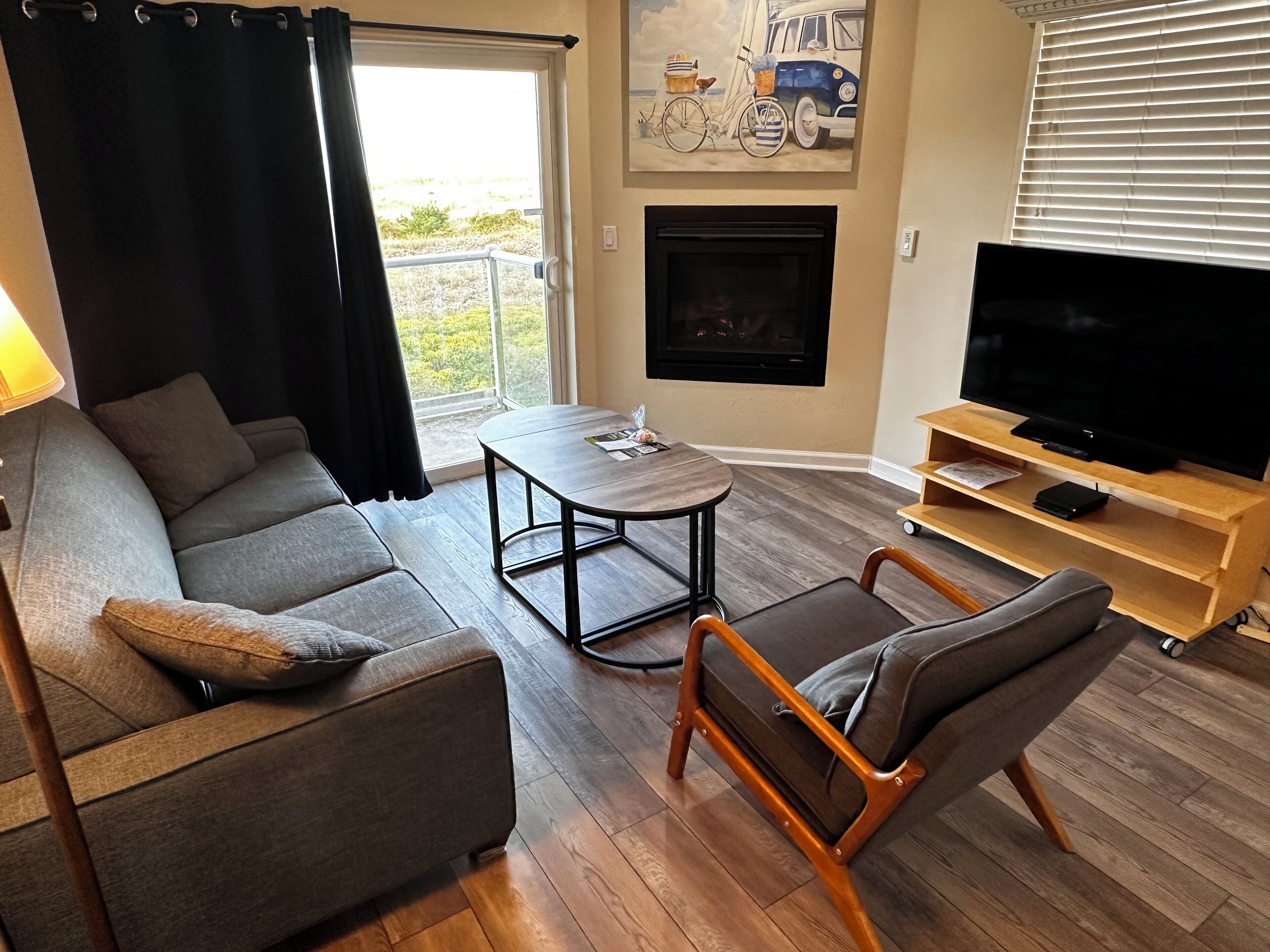 Deluxe Suite, 2 Bedrooms, Ocean View, Oceanfront | Living area | 50-inch flat-screen TV with cable channels, TV, fireplace