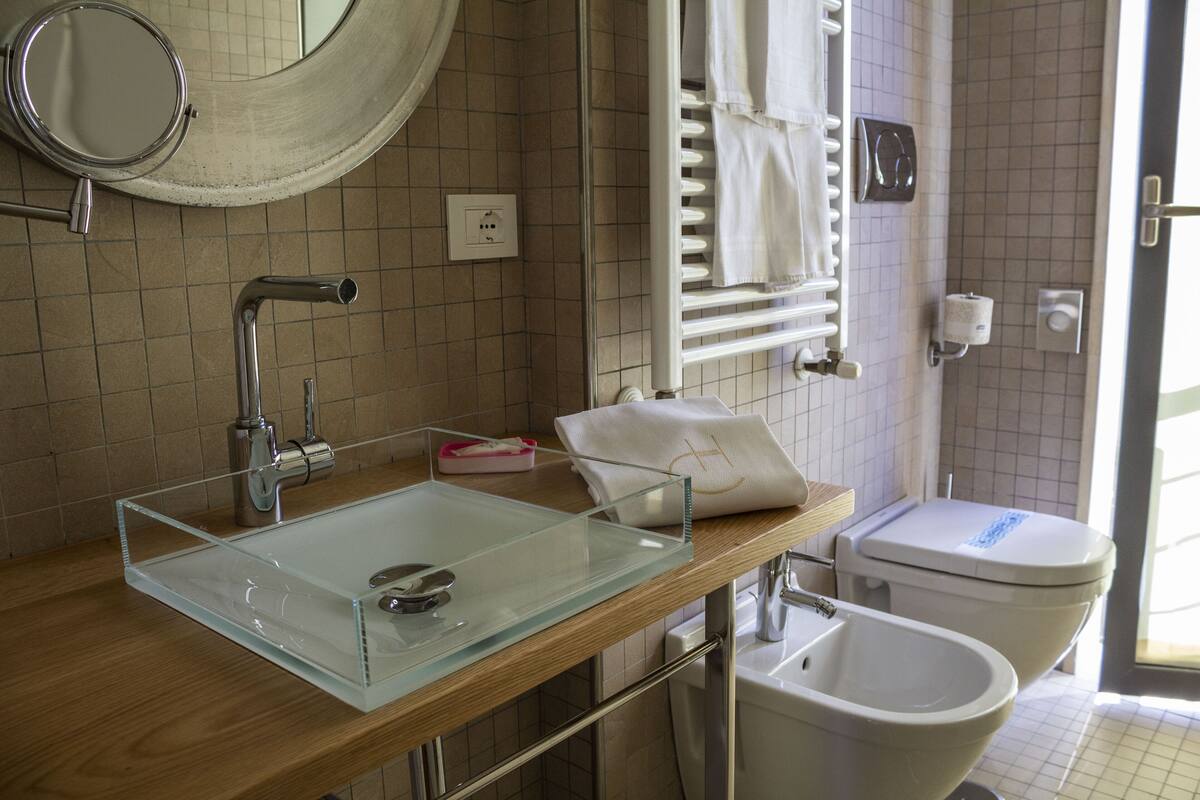 superior room | bathroom | shower, rainfall showerhead, free toiletries, hair dryer