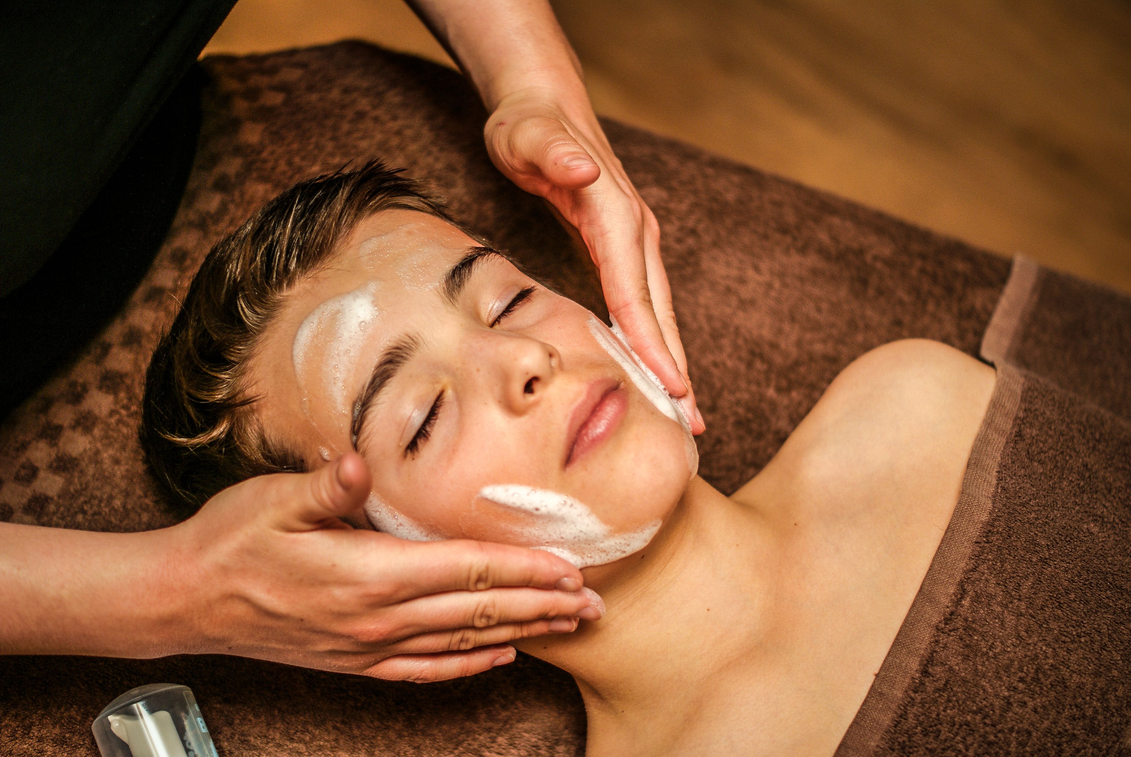 A person receiving a facial treatment.