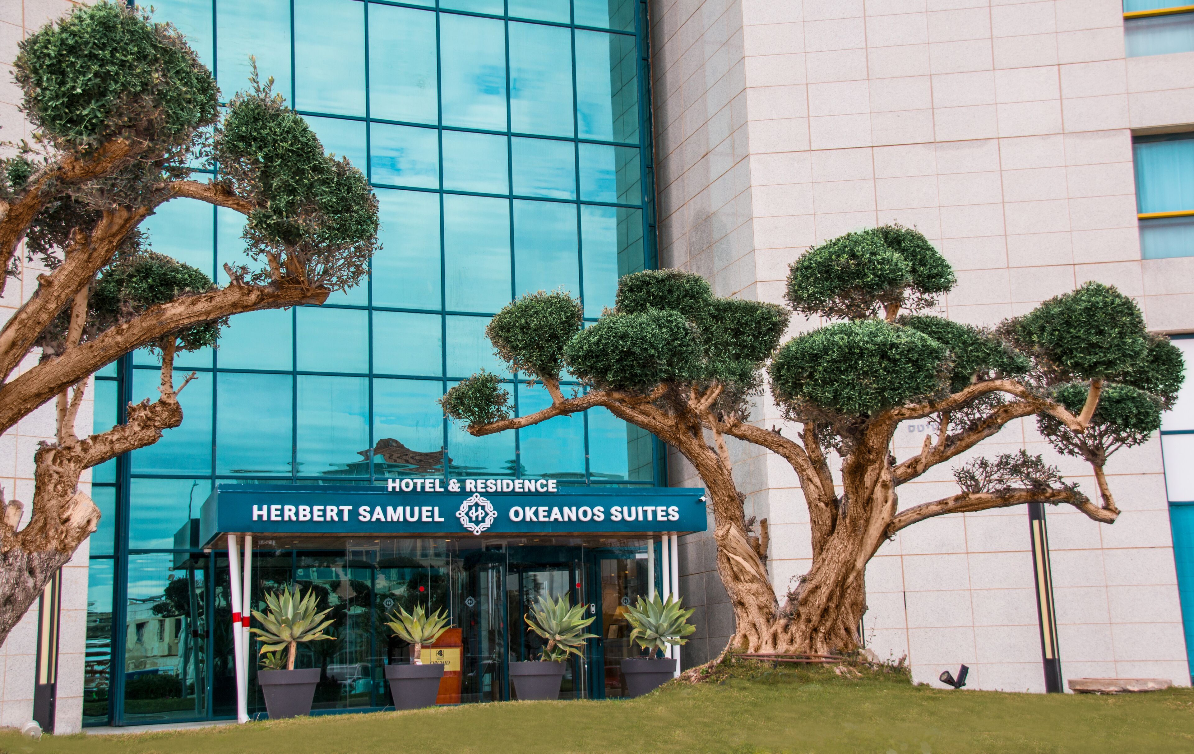 The exterior of the Herbert Samuel Hotel & Residence with Okeanos Suites.