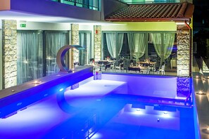 Outdoor pool, a waterfall pool, sun loungers