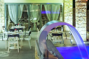 Outdoor pool, a waterfall pool, pool loungers