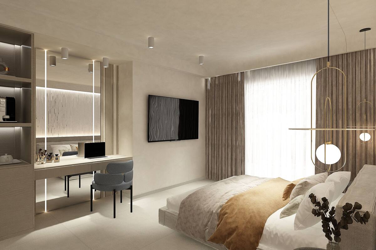 A modern bedroom with a bed, desk, chair, and a large window with curtains.