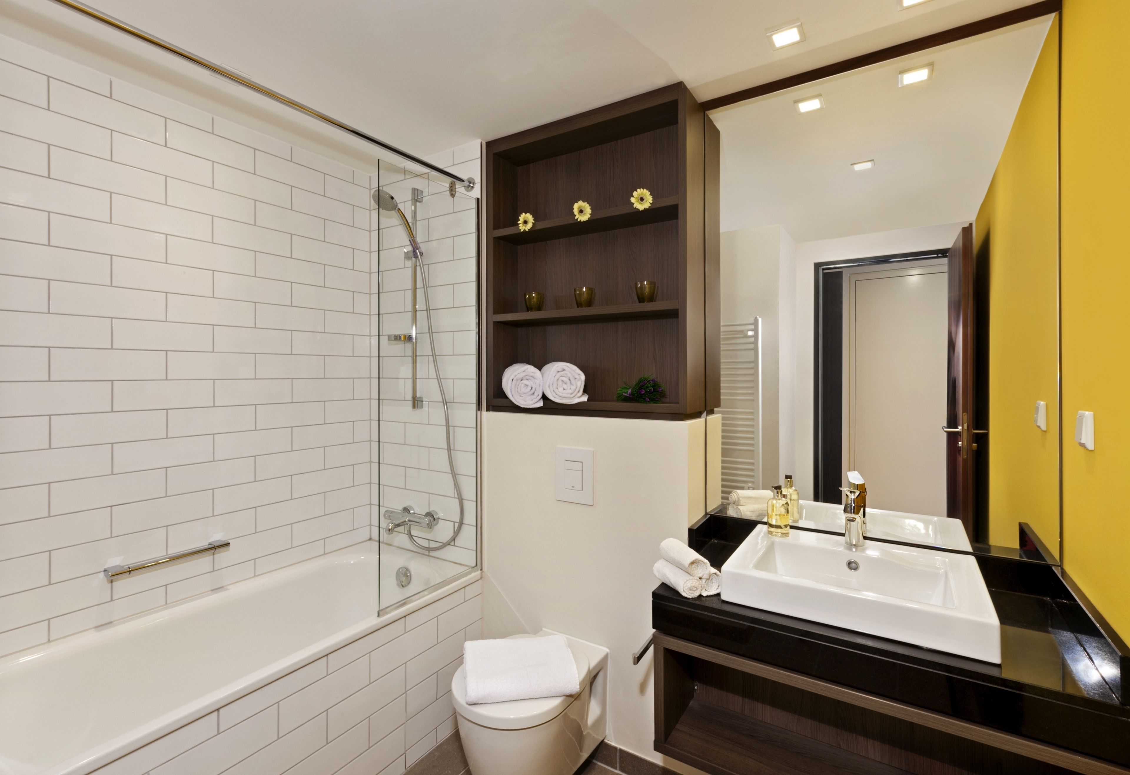 deep-soaking bathtub, eco-friendly toiletries, hair dryer, towels