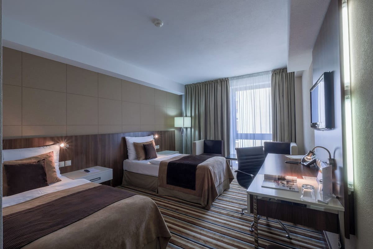 standard room | in-room safe, desk, laptop workspace, blackout curtains