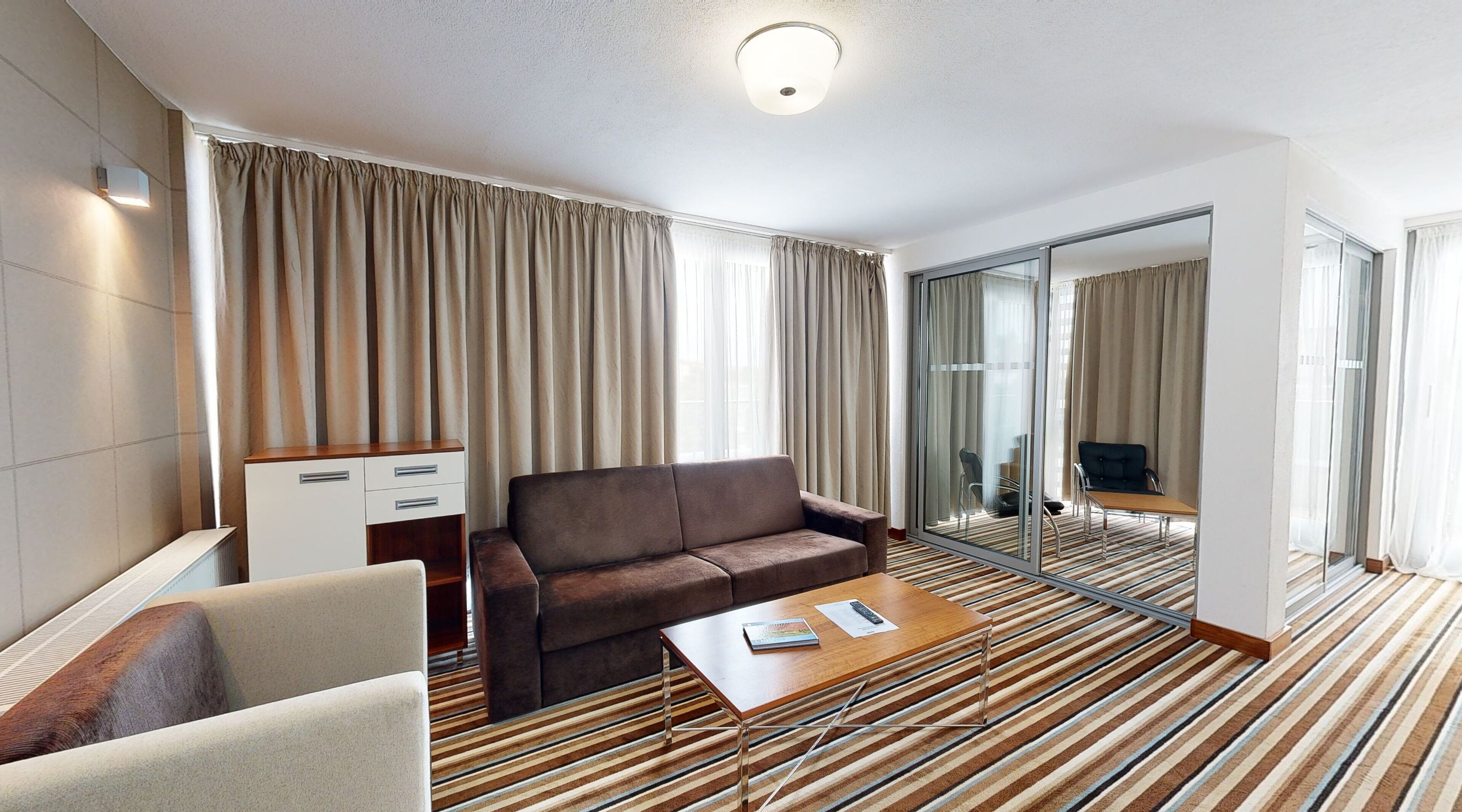 deluxe apartment | living area | flat-screen tv