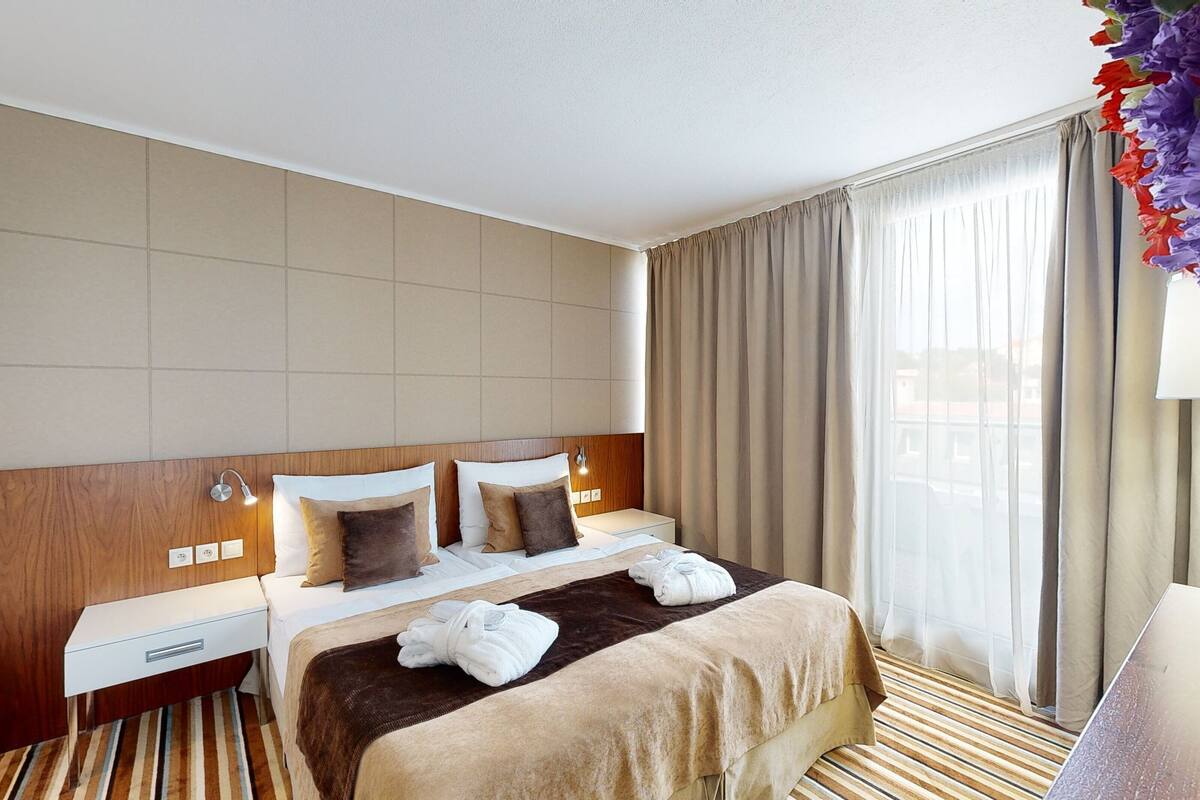 deluxe apartment | in-room safe, desk, laptop workspace, blackout curtains