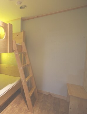 A room with a bunk bed, a wooden ladder, and a small wooden table. - Hi Korea Guest House - Hostel, Caters to Women (Busan)