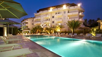 Seasonal outdoor pool, a waterfall pool, pool umbrellas, sun loungers