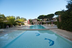Seasonal outdoor pool, a waterfall pool, pool umbrellas, pool loungers