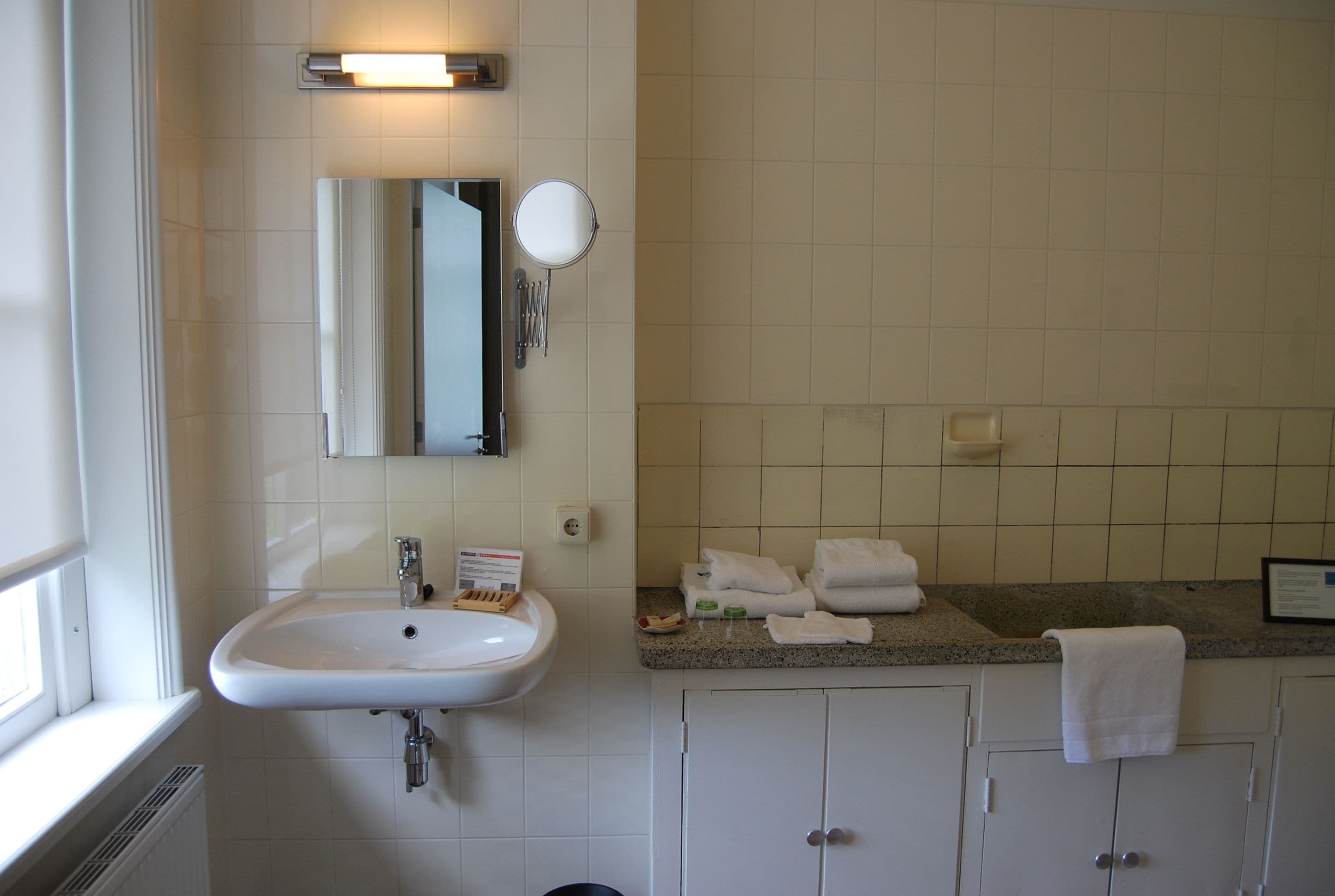 comfort room, 2 single beds, garden view | bathroom | eco-friendly toiletries, towels