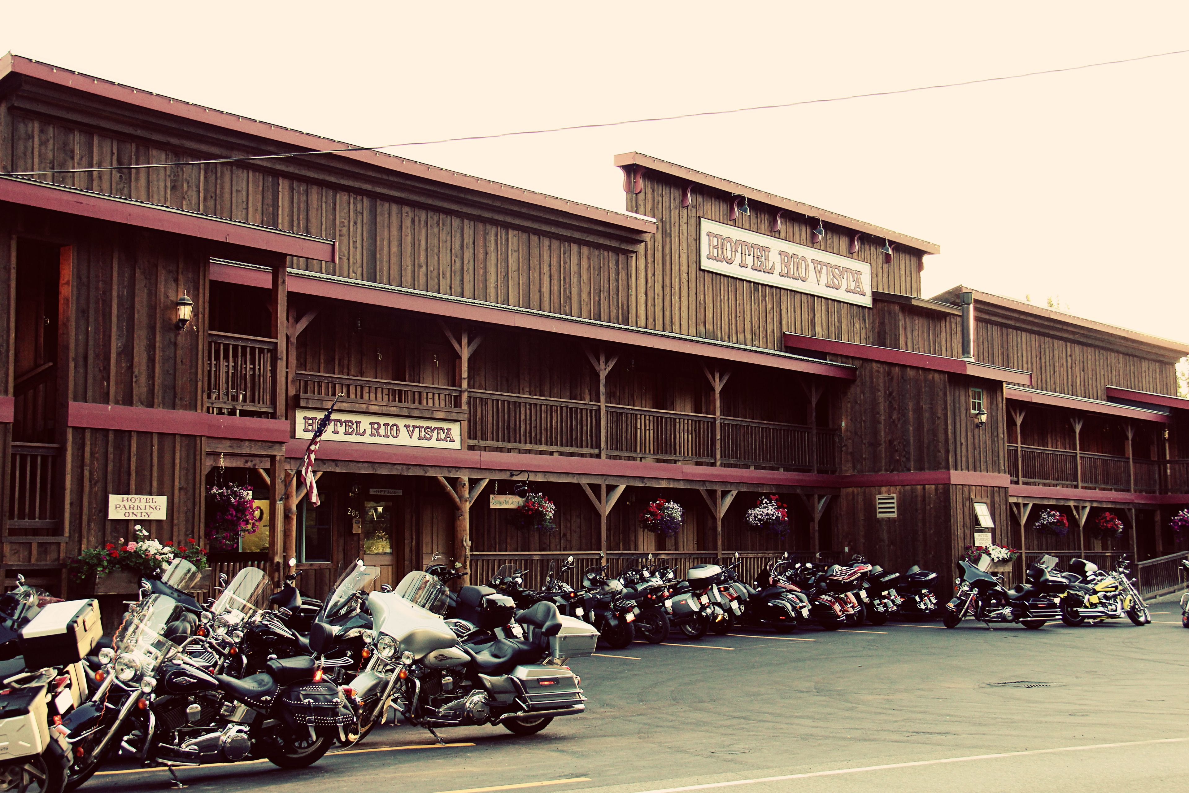 A hotel with a wooden facade and multiple balconies.