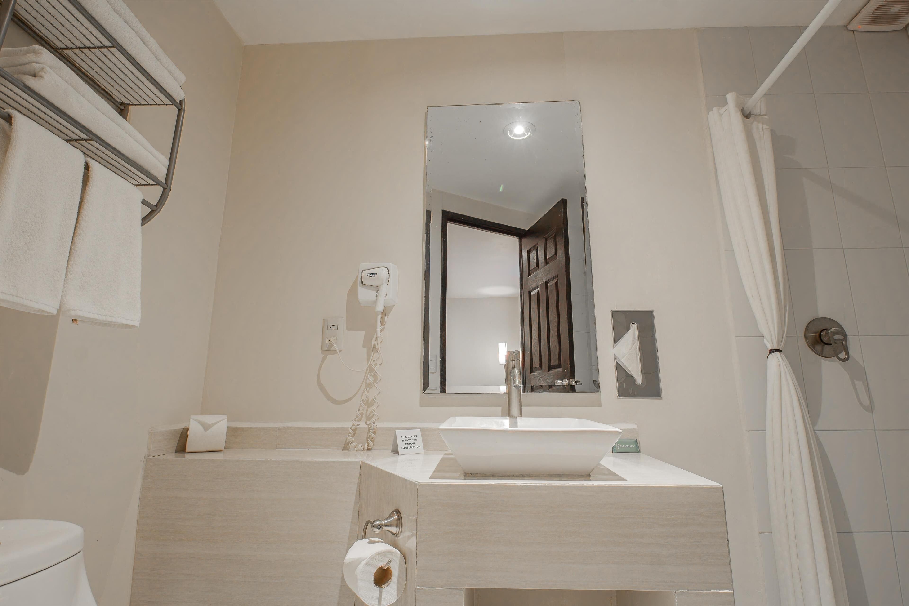 suite, 1 king bed, non smoking | bathroom | shower, rainfall showerhead, free toiletries, hair dryer